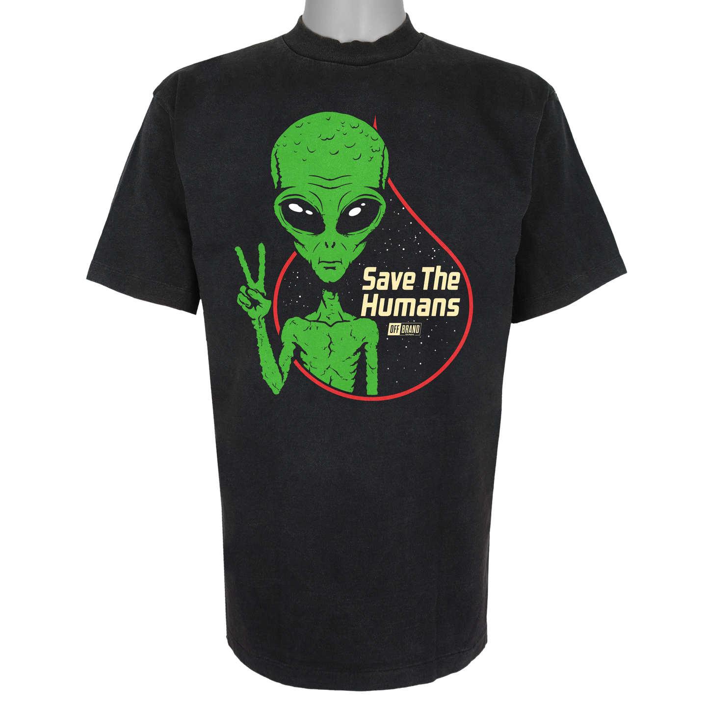 Save The Humans parody t-shirt featuring a green alien holding up a peace sign in front of a starry background on a Vintage Black garment.